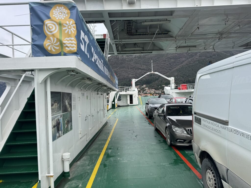 Bay of Kotor ferry car deck with vehicles — Lepetane to Kamenari crossing February