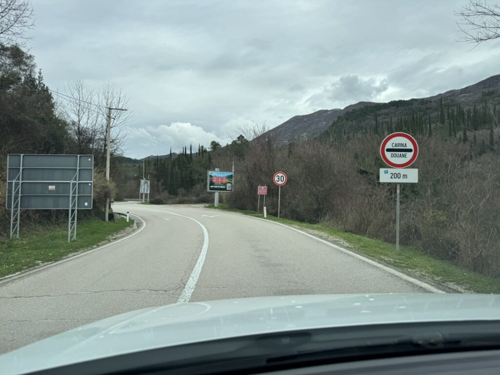 Montenegro-Croatia border road sign CARINA DOUANE 200m approaching Debeli Brijeg