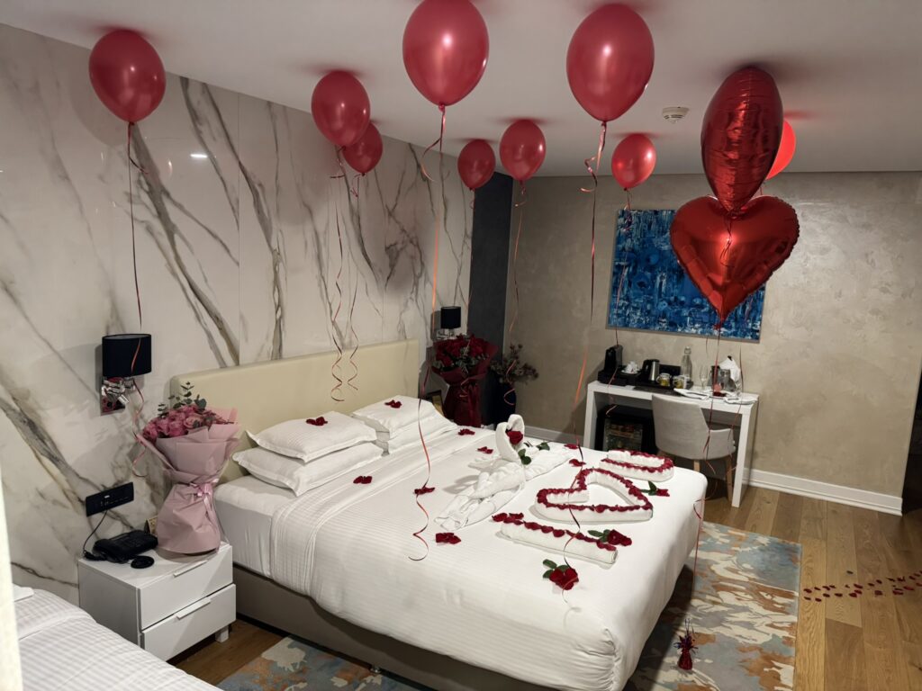 Valentine's room decoration at Rixos Dubrovnik — rose petals spelling I Love You on bed