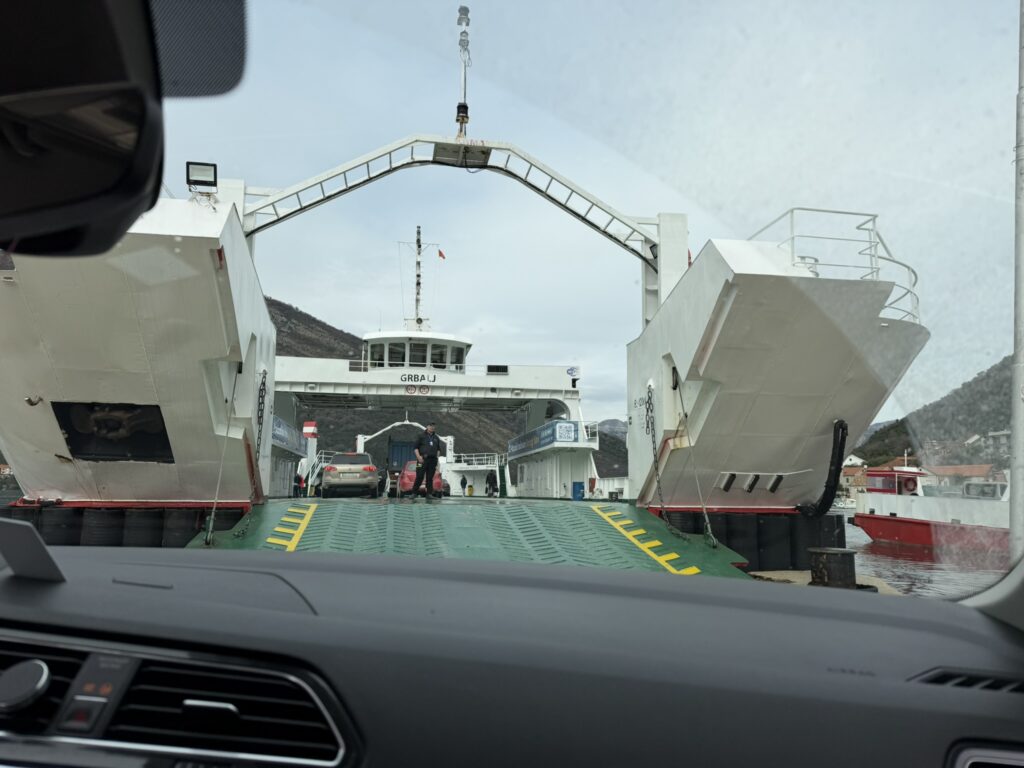 Loading onto Kotor Bay ferry Lepetane-Kamenari — car approaching open ramp