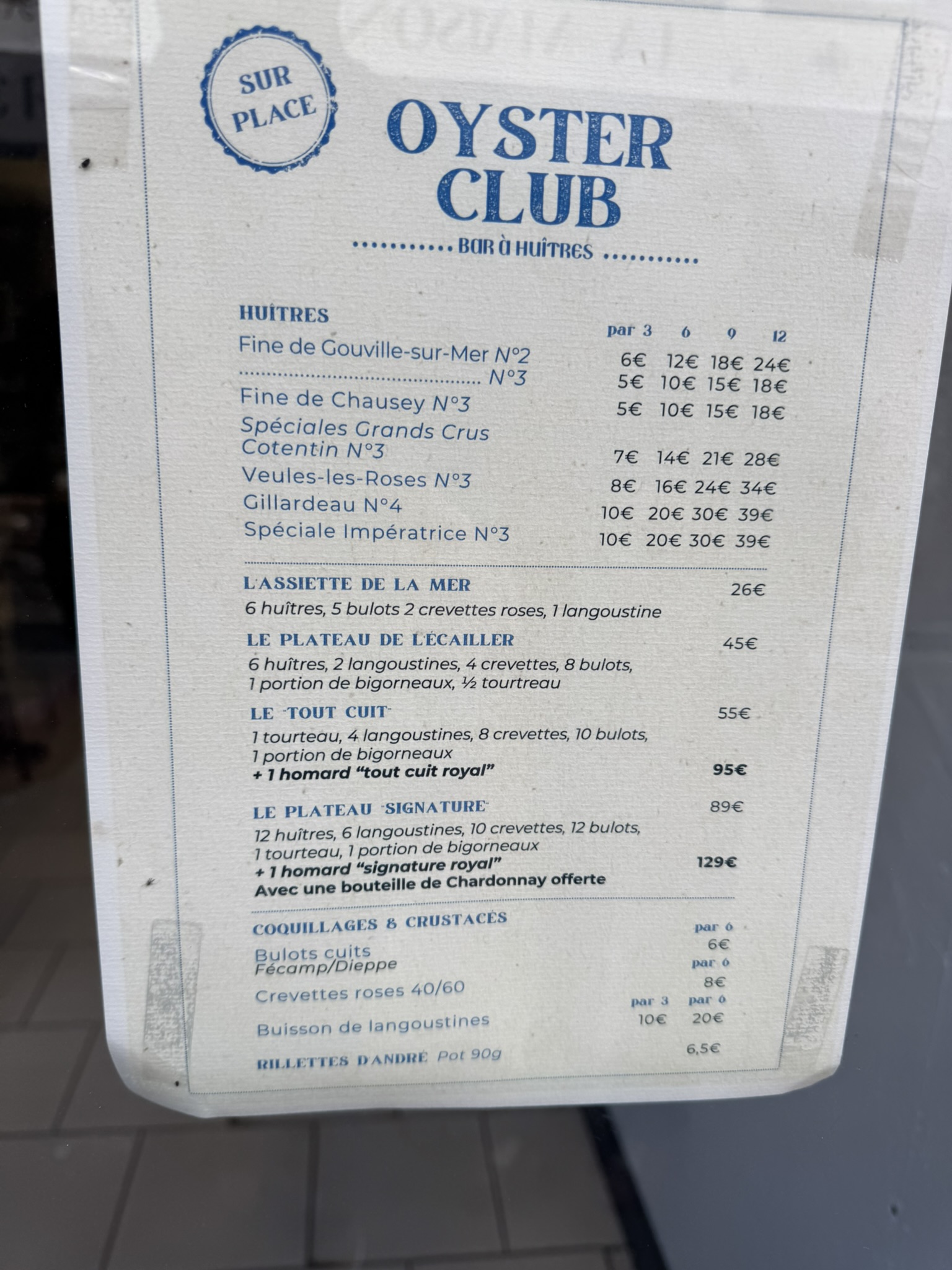 Oyster Club menu in Etretat with seafood prices during a France road trip