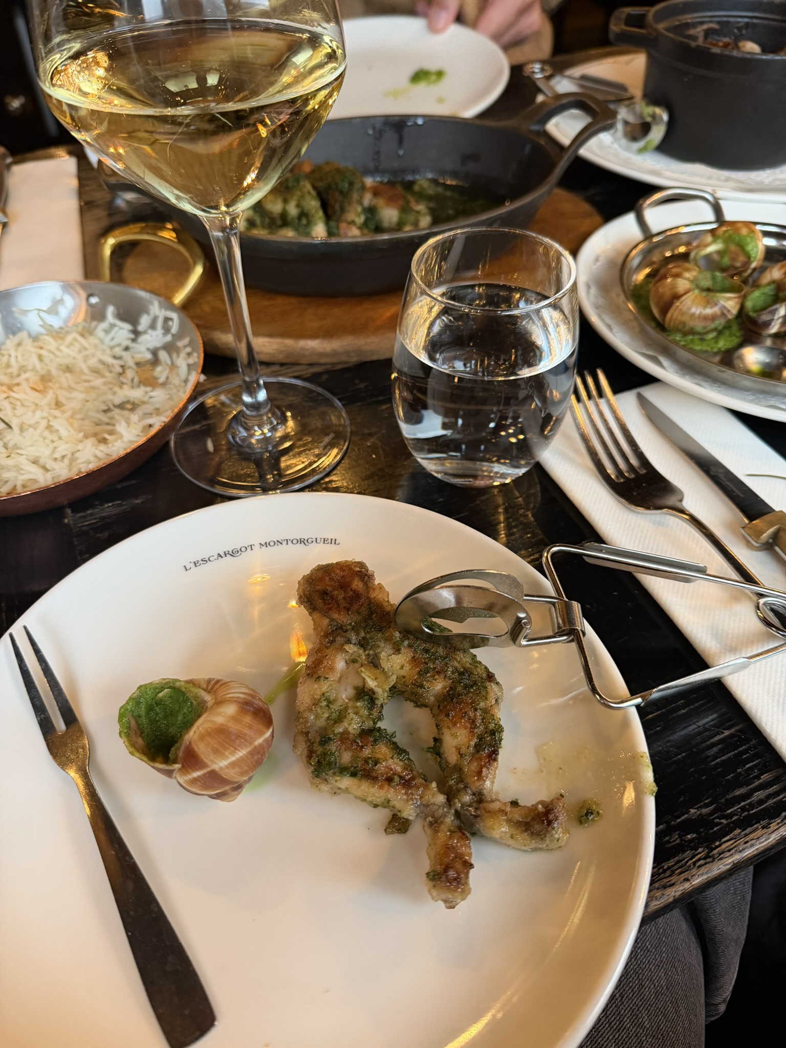 Escargot dish in Paris during a family France road trip food stop