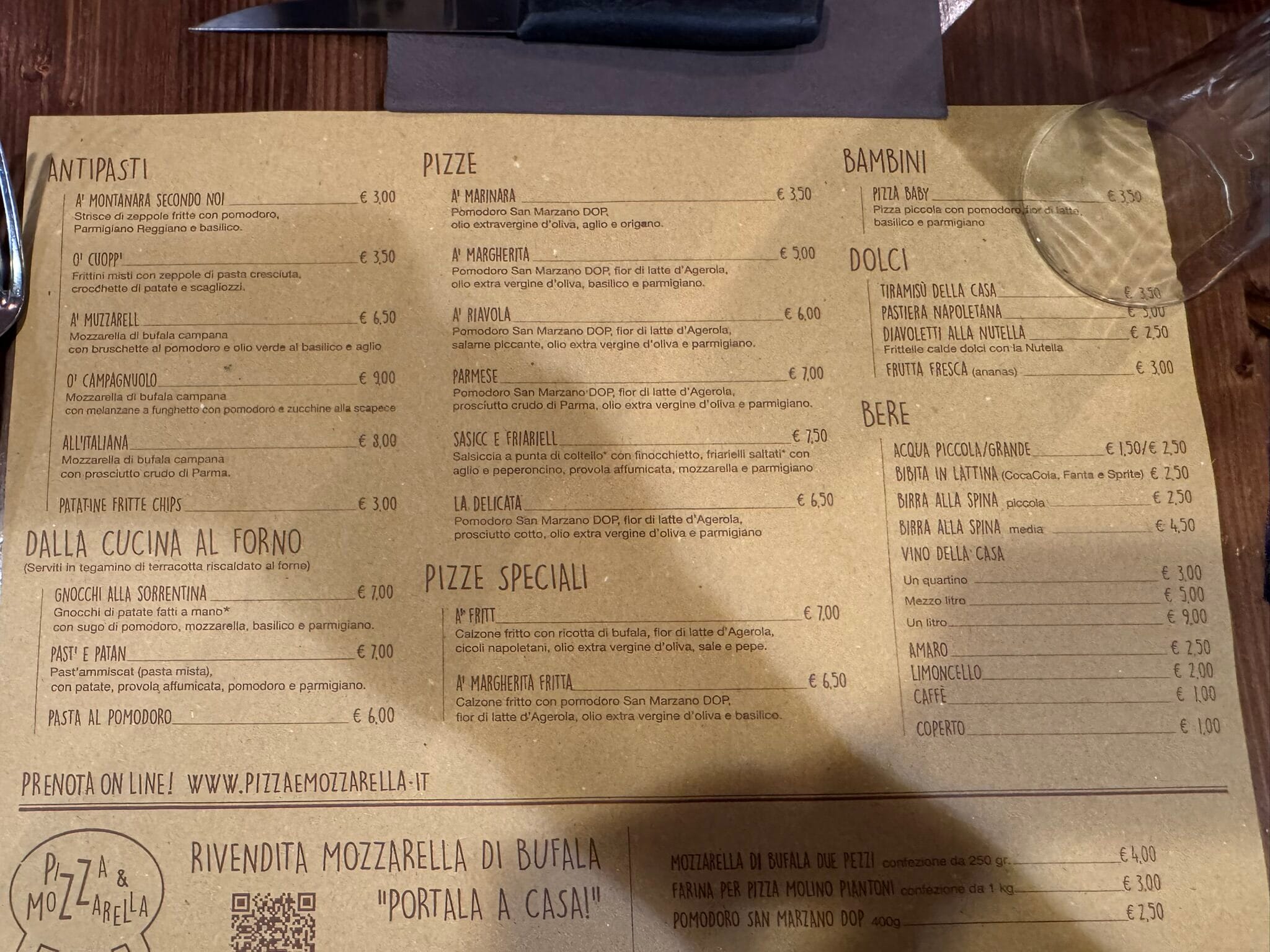 Close-up menu at Pizza and Mozzarella in Milan.