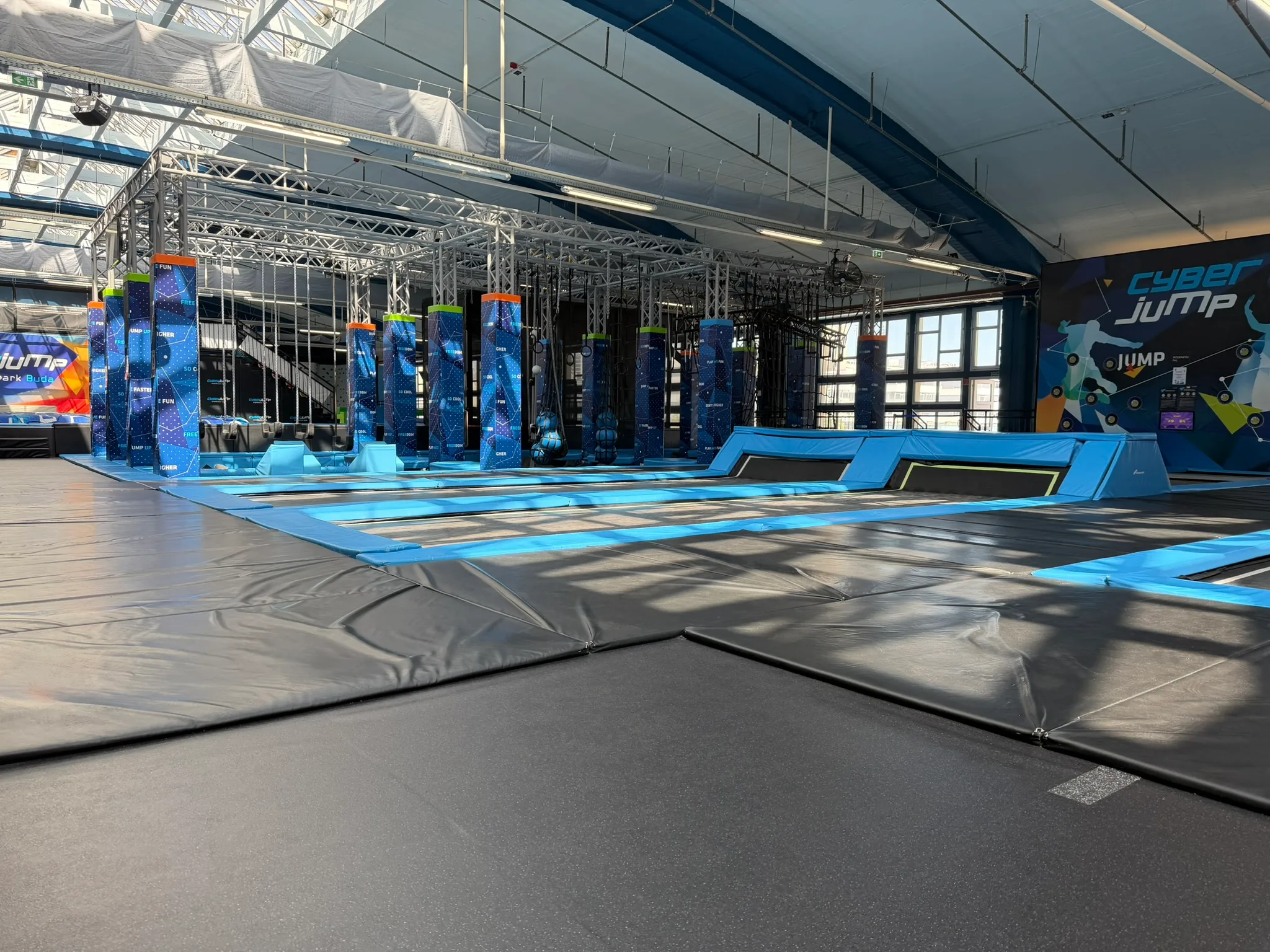 Wide view of CyberJump Park Buda trampoline area.