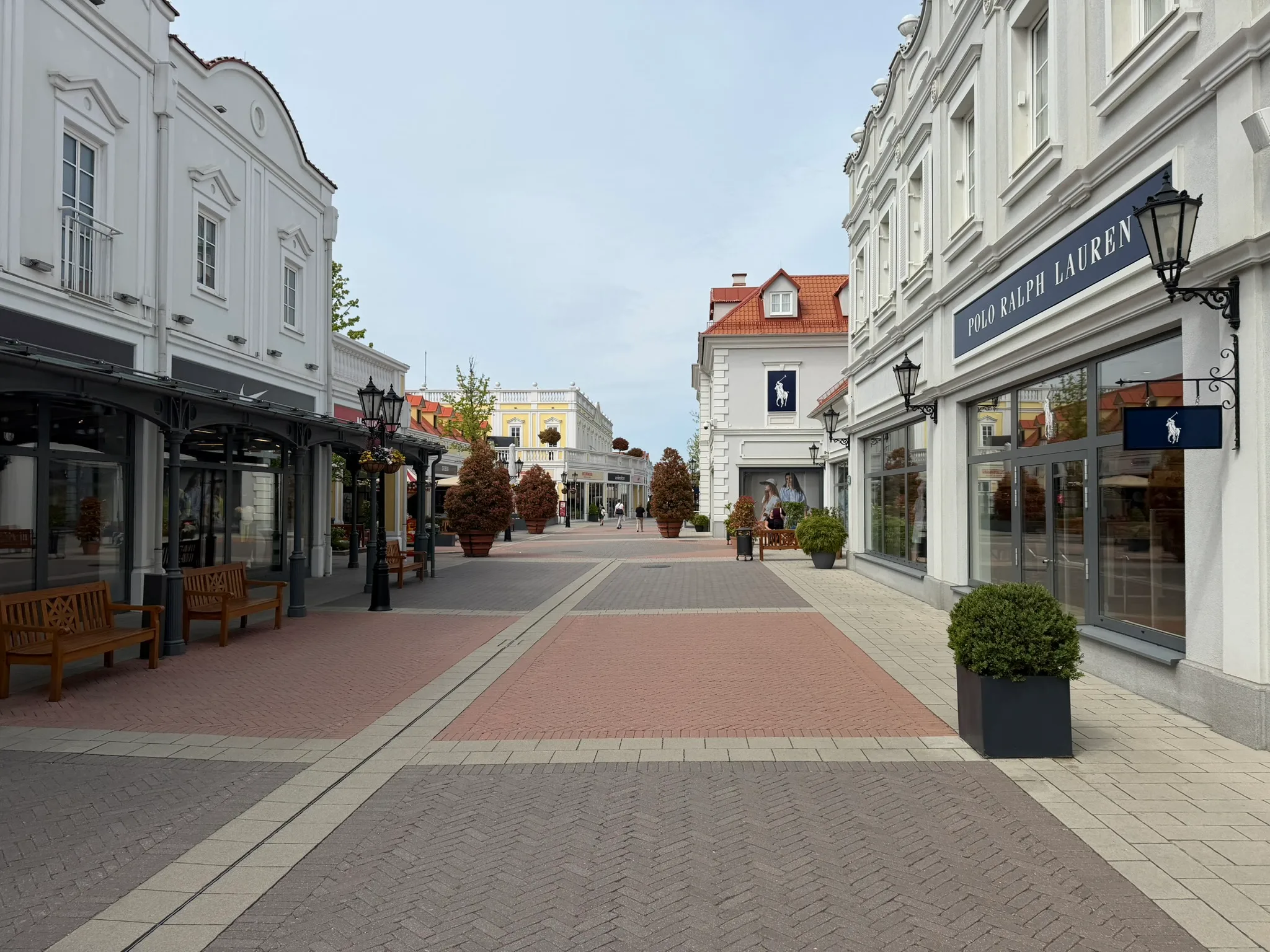 Street view at Designer Outlet Parndorf during a family road trip stop.